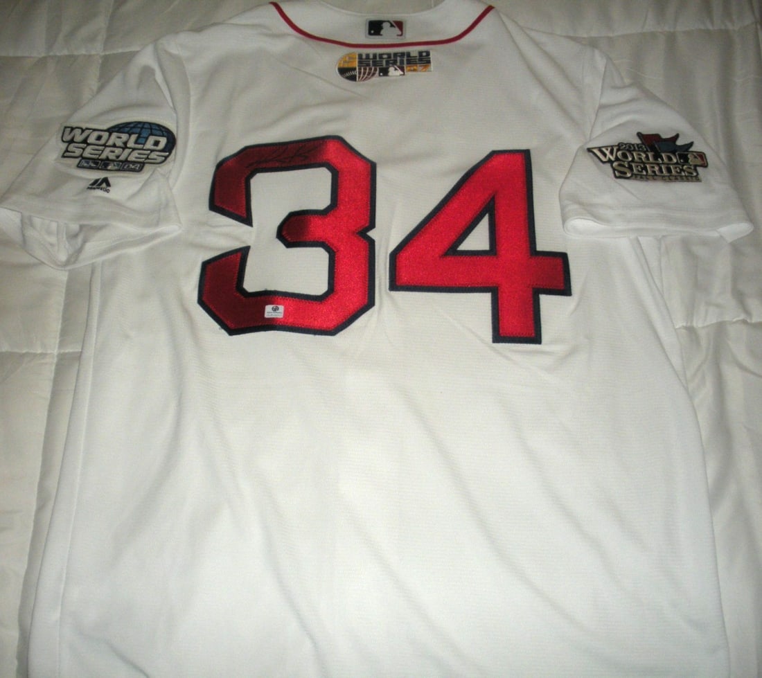 Signed Majestic Boston Red Sox David Ortiz MLB Jersey GAI COA: Signed Majestic Boston Red Sox David Ortiz MLB Jersey GAI COA This is an official licensed Majestic Boston Red Sox jersey signed by David Ortiz. The jersey celebrates Ortiz's three World Series victor