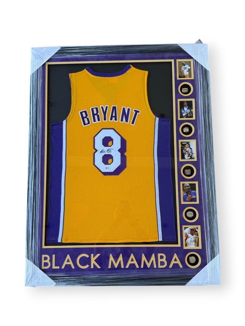 Framed Kobe Bryant Lakers jersey with replica rings BAS authenticated: Framed Kobe Bryant Lakers jersey with replica rings BAS authenticated This framed Los Angeles Lakers jersey features the authentic signature of Kobe Bryant and includes replica championship rings. The