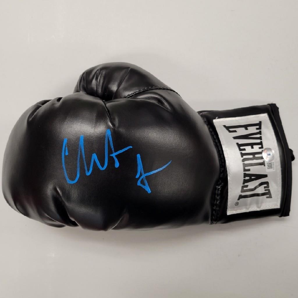 Boxing Glove Signed by Christian Bale from The Fighter Beckett Authenticated: Boxing Glove Signed by Christian Bale from The Fighter Beckett Authenticated This is an original boxing glove autographed by Christian Bale, known for his role in the movie The Fighter. The signature 