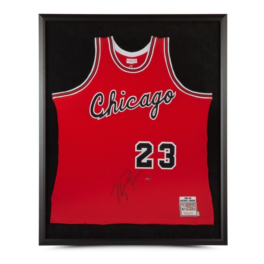 Michael Jordan 1984-85 Signed Framed Red Jersey Chicago Bulls: Michael Jordan 1984-85 Signed Framed Red Jersey Chicago Bulls Celebrate the legacy of basketball legend Michael Jordan with this original autographed 1984-85 Mitchell & Ness framed red jersey. This ic