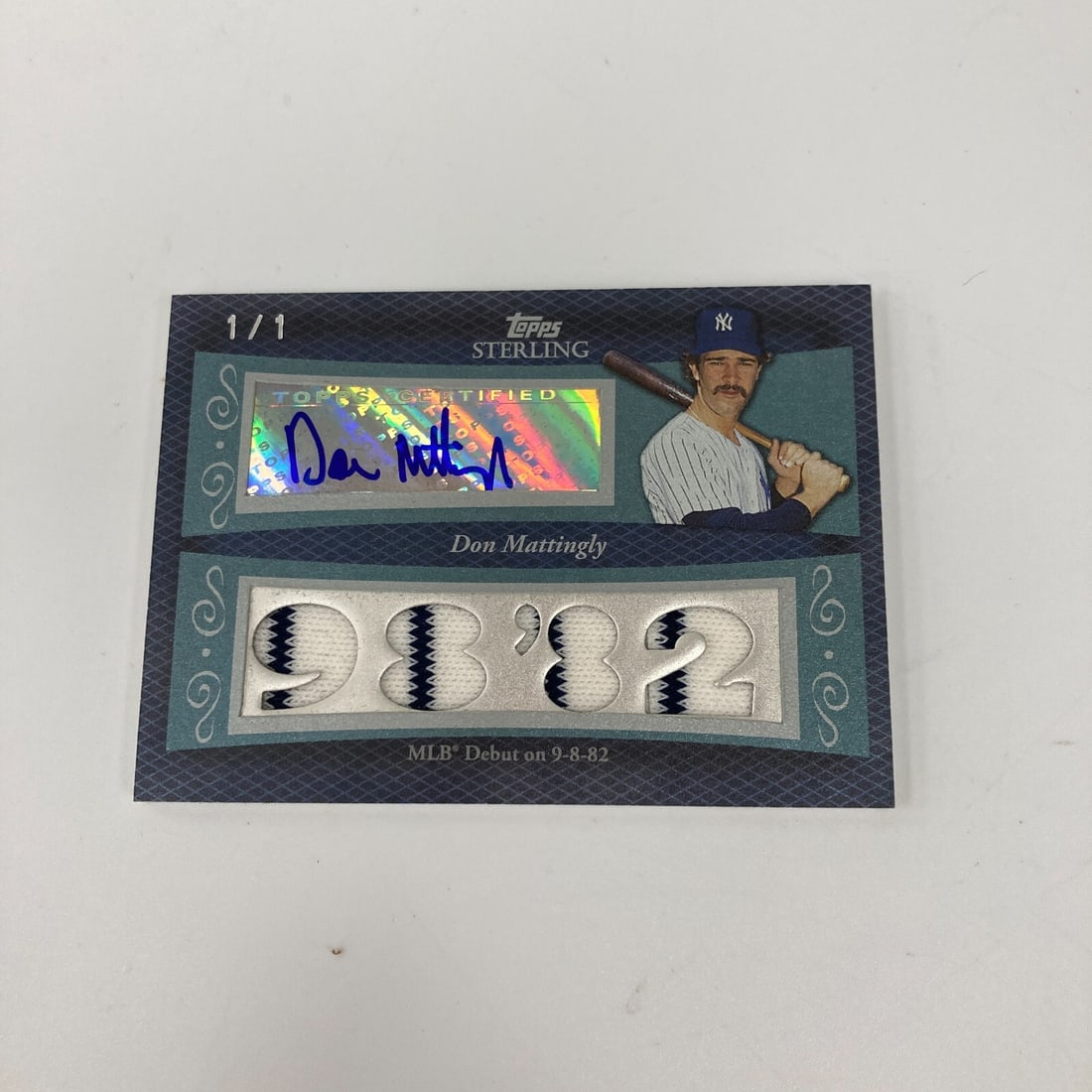 2008 Topps Sterling Don Mattingly Autographed Game Used Jersey Patch 1/1: 2008 Topps Sterling Don Mattingly Autographed Game Used Jersey Patch 1/1 This unique 2008 Topps Sterling trading card features a game-used jersey patch of the legendary baseball player Don Mattingly. 