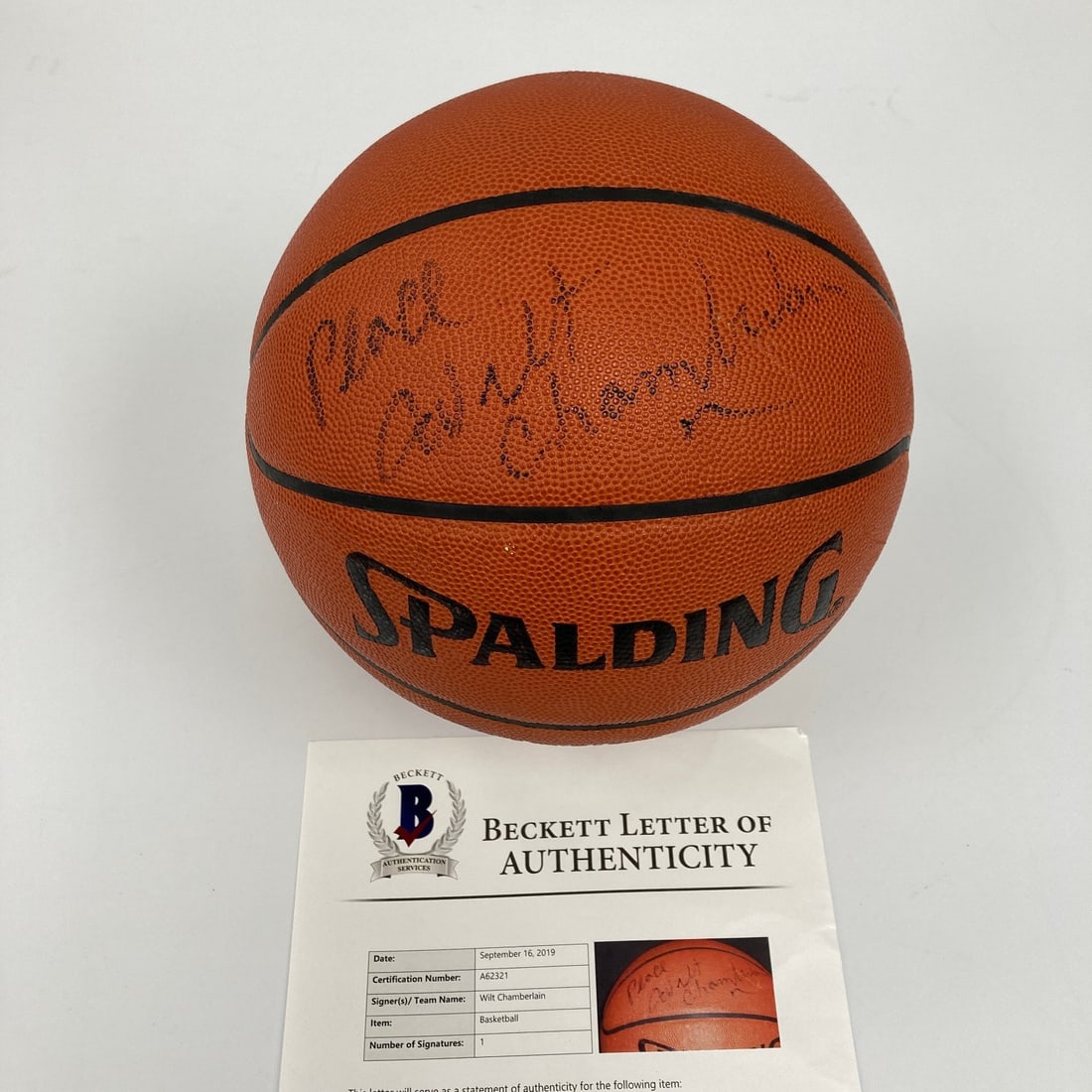 Beckett Authenticated Wilt Chamberlain Peace Spalding NBA Game Ball: Beckett Authenticated Wilt Chamberlain Peace Spalding NBA Game Ball This Spalding Official NBA Game Basketball is personally signed by Wilt Chamberlain with the inscription "Peace." The autograph has 