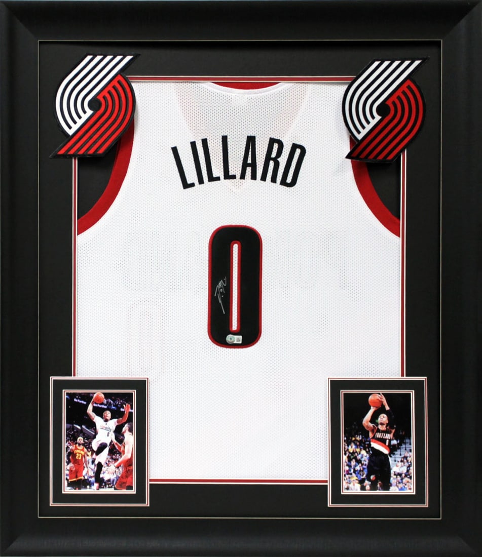 Framed White Pro Style Jersey Signed by Damian Lillard Beckett Witnessed: Framed White Pro Style Jersey Signed by Damian Lillard Beckett Witnessed This autographed white pro style framed jersey has been personally signed by Damian Lillard of the Portland Trail Blazers. It