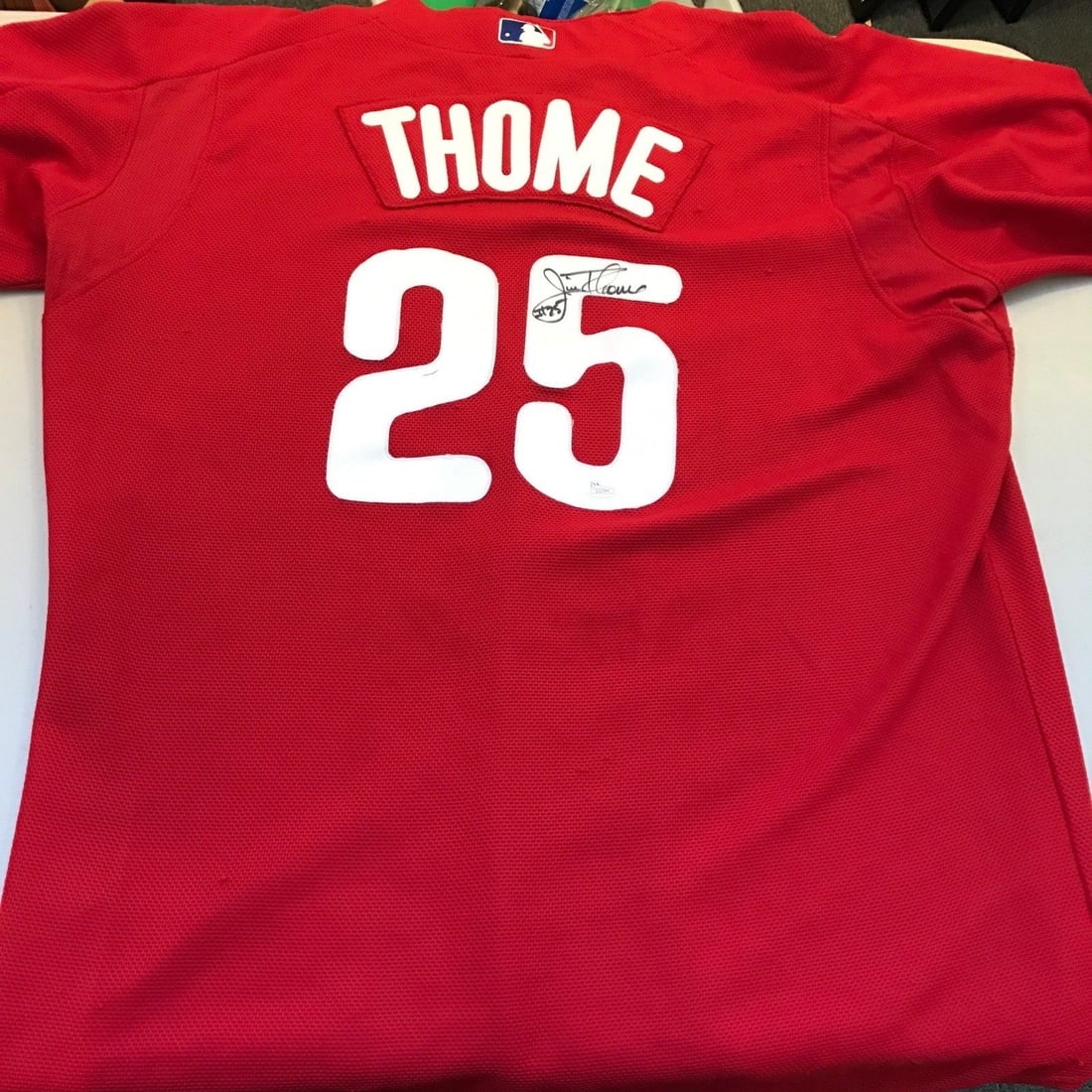 2012 Jim Thome Signed Game Used Phillies Jersey JSA Authenticated: 2012 Jim Thome Signed Game Used Phillies Jersey JSA Authenticated This is a 2012 game-used signed jersey from Jim Thome, a renowned player for the Philadelphia Phillies. The jersey, sized 52, exhibits