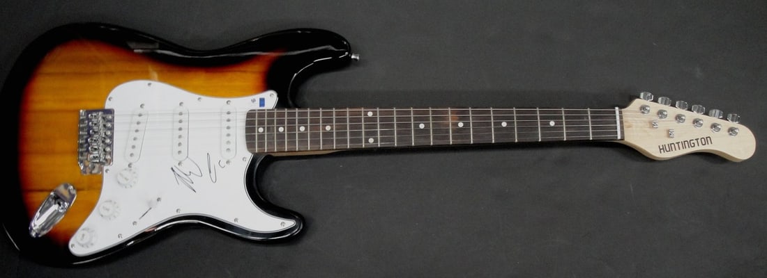 Meghan Trainor Autographed Electric Guitar GAI Authentication: Meghan Trainor Autographed Electric Guitar GAI Authentication This is an authentic electric guitar autographed by Meghan Trainor, featuring her unique and sloppy signature. The guitar comes with authe