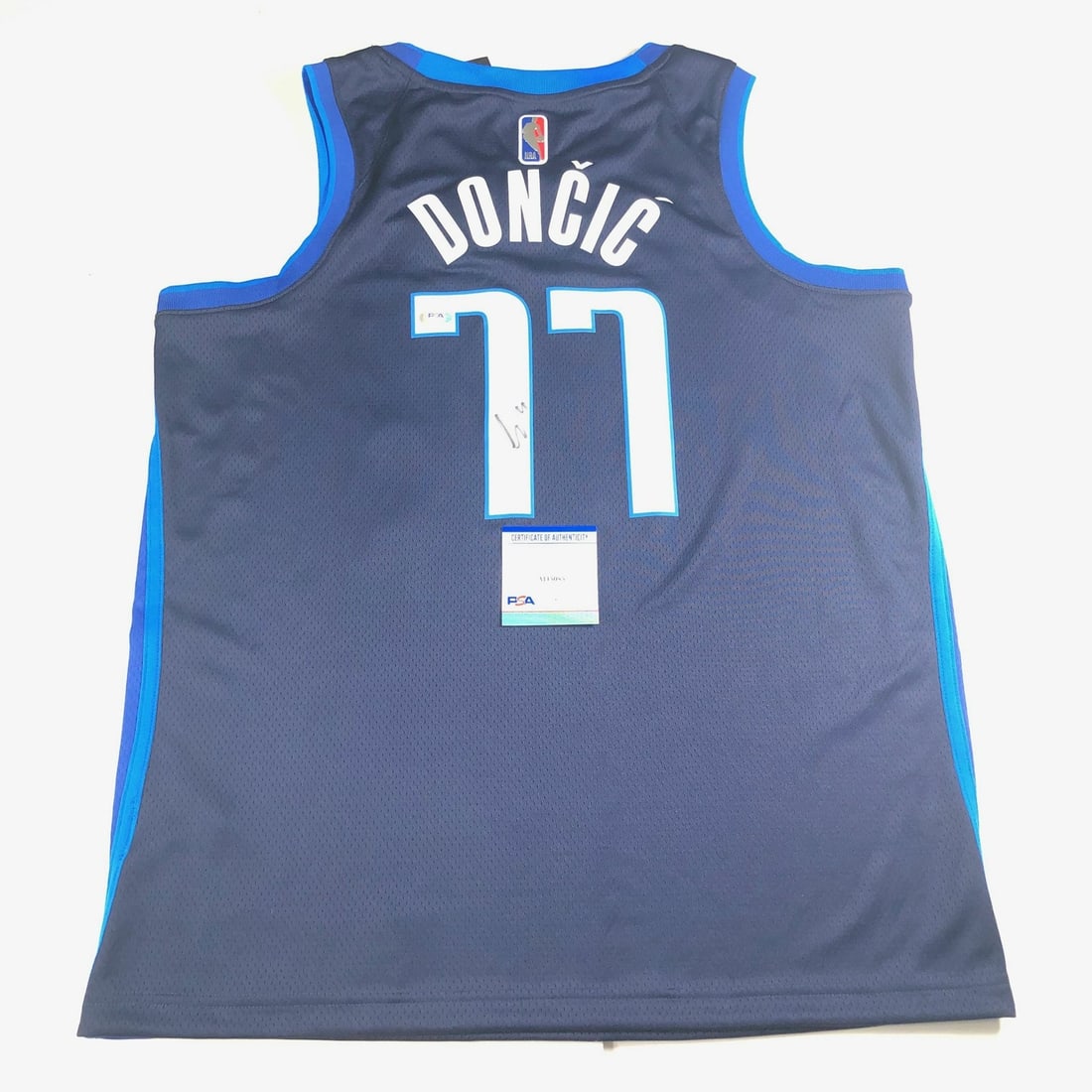 Luka Doncic PSA DNA autographed Dallas Mavericks stitched jersey: Luka Doncic PSA DNA autographed Dallas Mavericks stitched jersey This is a stitched Dallas Mavericks jersey autographed by Luka Doncic. The signature has been authenticated by Professional Sports Auth