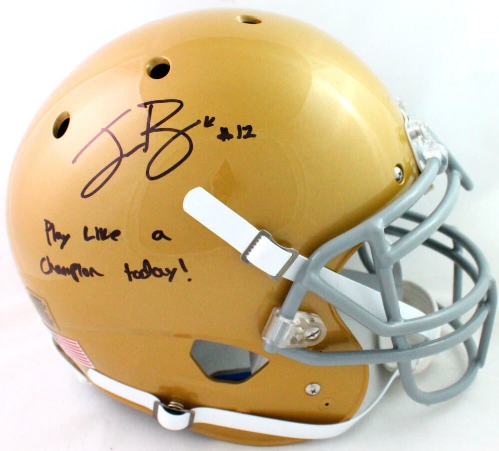 Notre Dame Fighting Irish Schutt Authentic Helmet Ian Book Beckett: Notre Dame Fighting Irish Schutt Authentic Helmet Ian Book Beckett This is an authentic full-size gold Schutt helmet featuring the Notre Dame Fighting Irish, autographed by Ian Book with an inscriptio