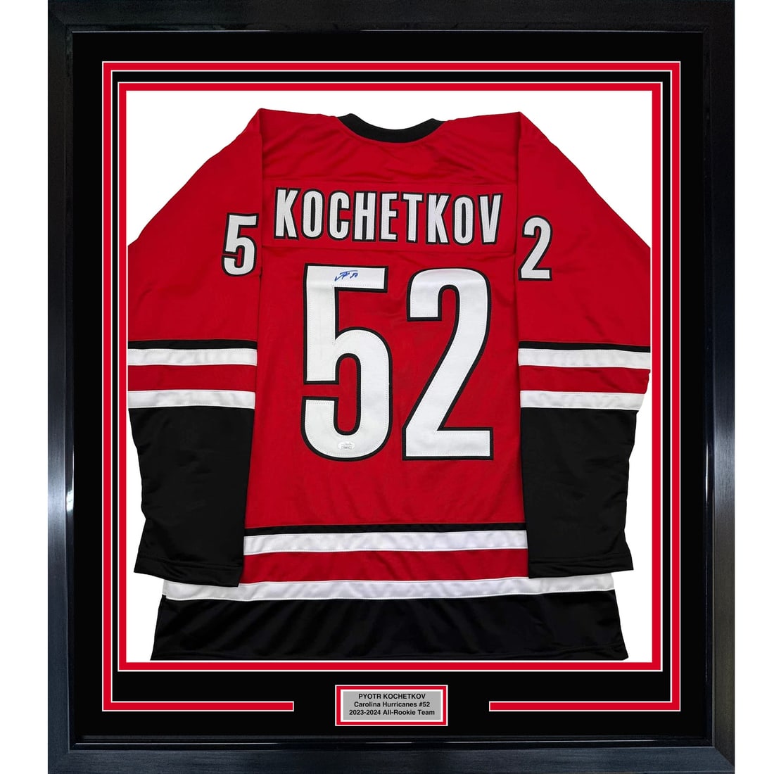 Framed Autographed Pyotr Kochetkov Jersey Carolina Hurricanes JSA COA 35x39: Framed Autographed Pyotr Kochetkov Jersey Carolina Hurricanes JSA COA 35x39 Showcase your appreciation for the NHL with this professionally framed autographed Pyotr Kochetkov jersey. This striking Car