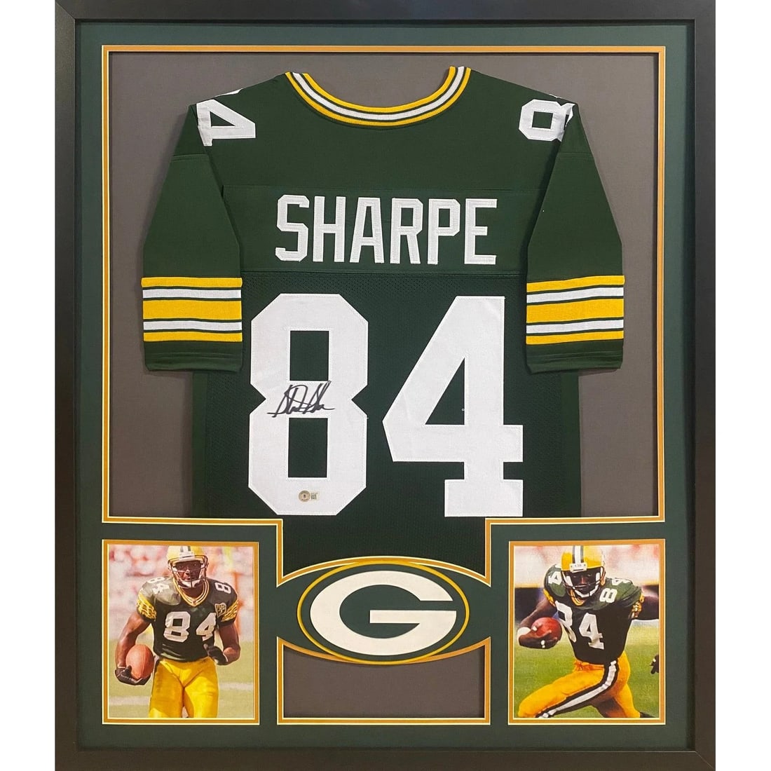 Sterling Sharpe Autographed Packers Jersey Framed with Beckett Authentication: Sterling Sharpe Autographed Packers Jersey Framed with Beckett Authentication This framed Green Bay Packers jersey is autographed by Sterling Sharpe and authenticated by Beckett. The display features 