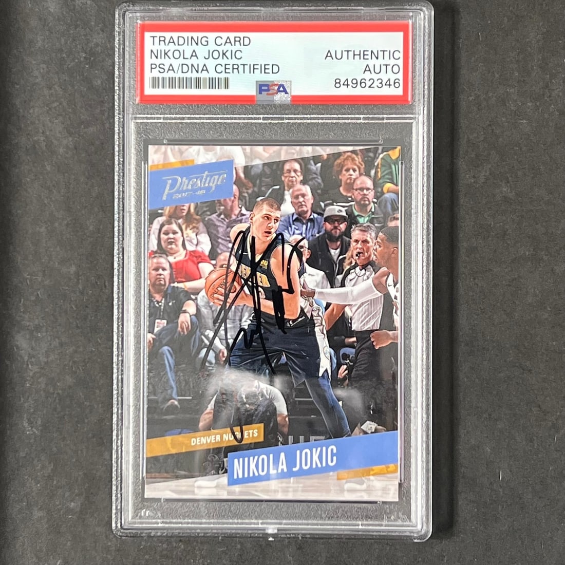 Nikola Jokic PSA authenticated signed Panini Prestige #86 Nuggets card: Nikola Jokic PSA authenticated signed Panini Prestige #86 Nuggets card This is a 2017-18 Panini Prestige #86 trading card featuring Nikola Jokic of the Denver Nuggets. The card has been signed by Niko
