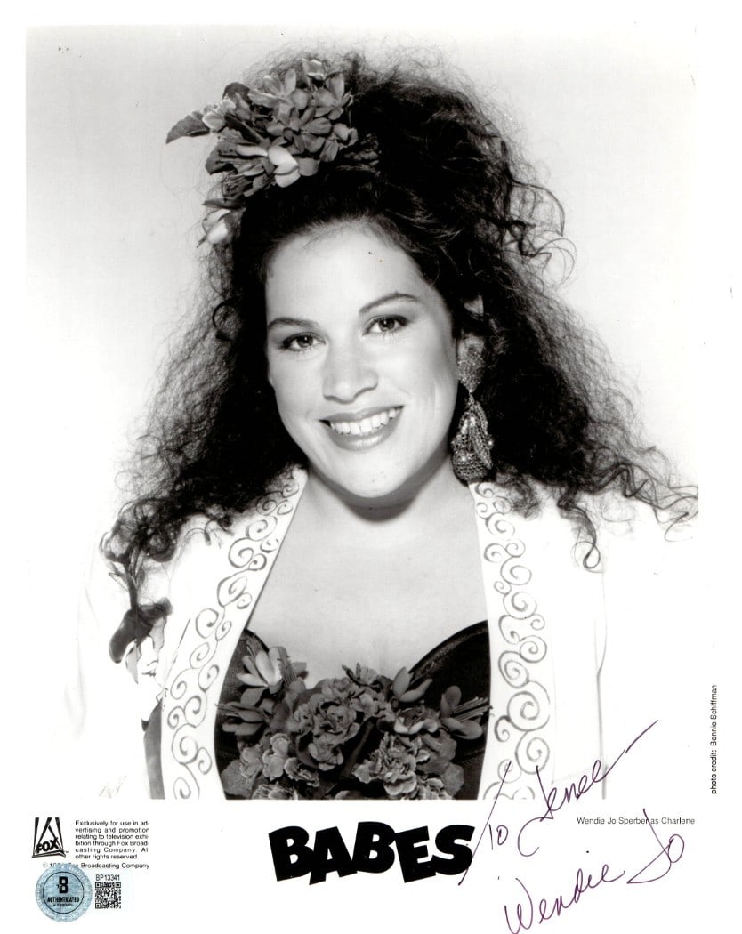 8X10 Photograph Signed by Wendie Jo Sperber Beckett Authenticated: 8X10 Photograph Signed by Wendie Jo Sperber Beckett Authenticated This is an original 8x10 photograph autographed by Wendie Jo Sperber, known for her role as Charlene in "Babes." The signature has bee