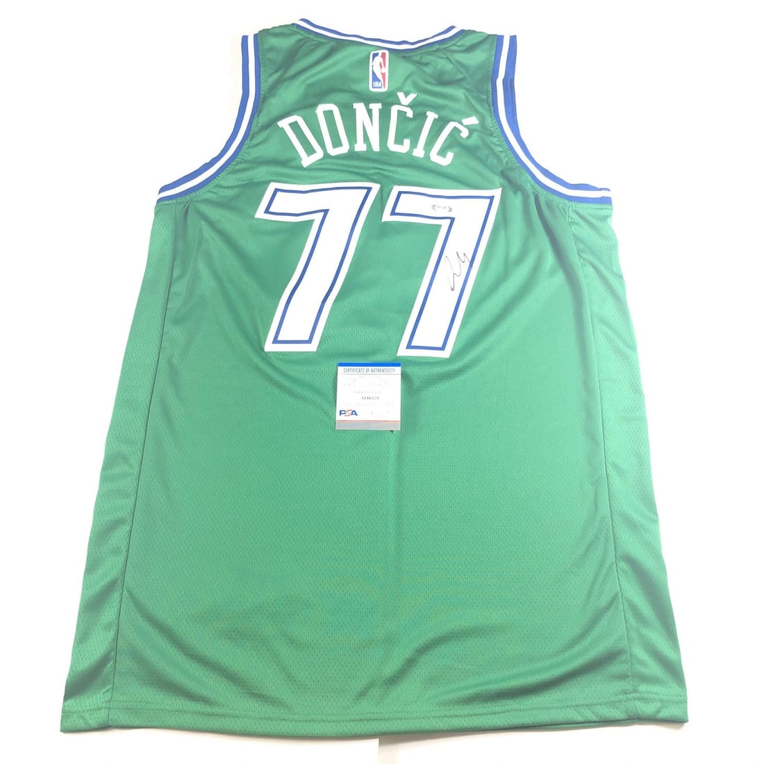Luka Doncic autographed Dallas Mavericks stitched jersey PSA DNA: Luka Doncic autographed Dallas Mavericks stitched jersey PSA DNA This is a stitched Dallas Mavericks jersey autographed by Luka Doncic. The autograph has been authenticated by PSA/DNA and received an 