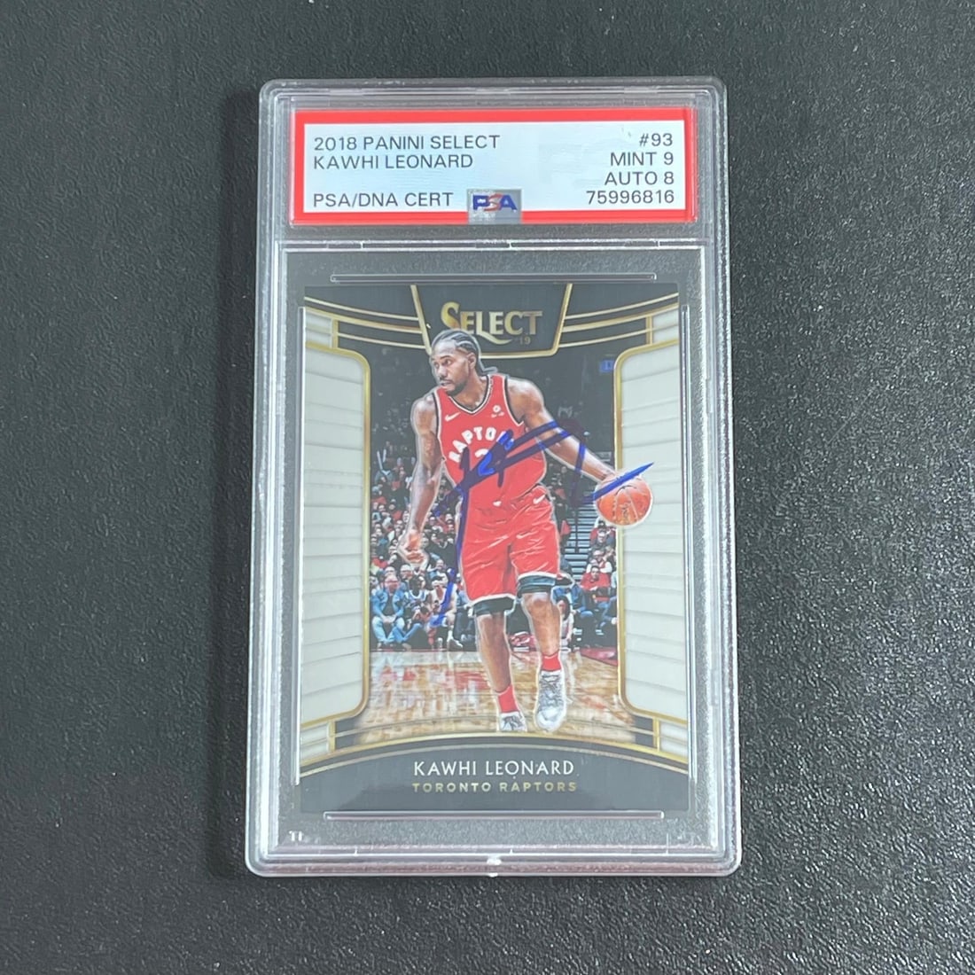Kawhi Leonard 2018 Panini Select PSA 9 Auto 8 Card #93 Raptors: Kawhi Leonard 2018 Panini Select PSA 9 Auto 8 Card #93 Raptors This is a 2018 Panini Select #93 Kawhi Leonard sports trading card featuring the Toronto Raptors star. The card is autographed by Kawhi L