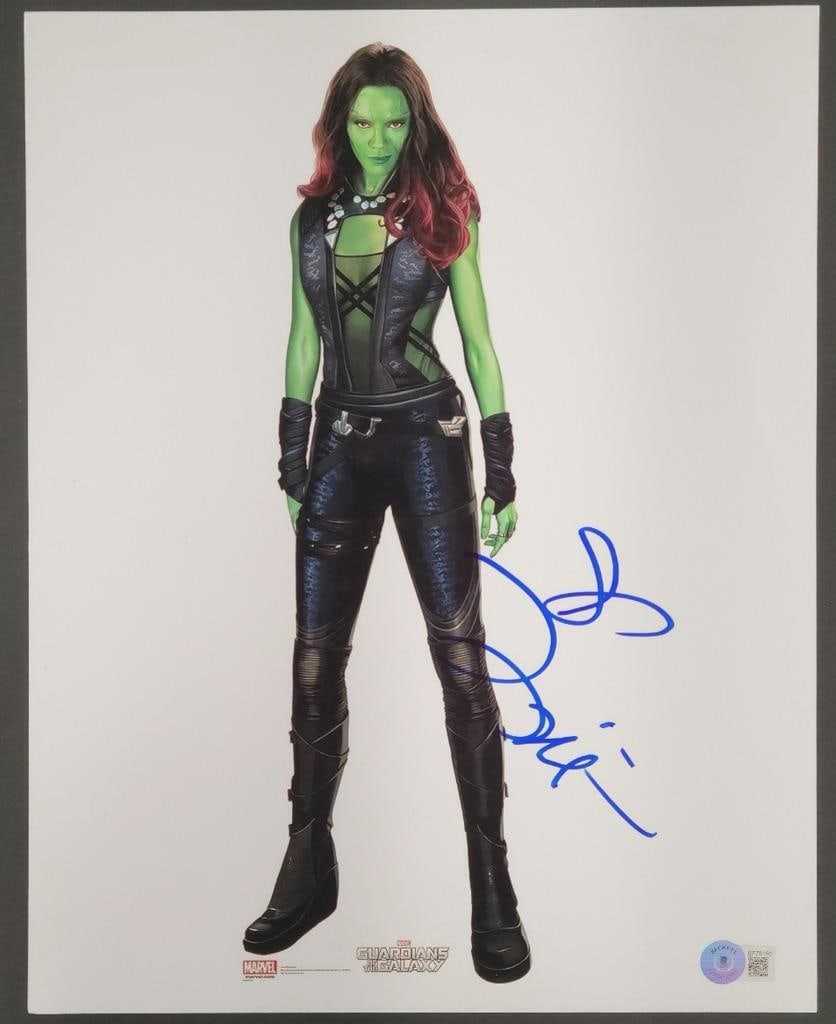 Beckett authenticated Zoe Saldana Gamora 11x14 signed photo: Beckett authenticated Zoe Saldana Gamora 11x14 signed photo This is an original 11x14 photograph featuring Zoe Saldana as Gamora from the movie Guardians of the Galaxy. The photo is hand-signed by Zoe