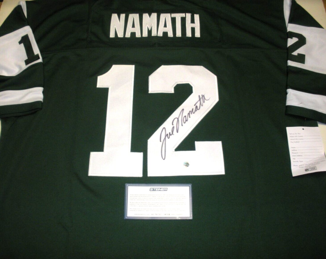 Joe Namath Signed Mitchell & Ness Jersey with COA: Joe Namath Signed Mitchell & Ness Jersey with COA This official licensed Mitchell & Ness jersey features the iconic Joe Namath, a legendary figure in NFL football. The jersey is a pre-owned item, ensu