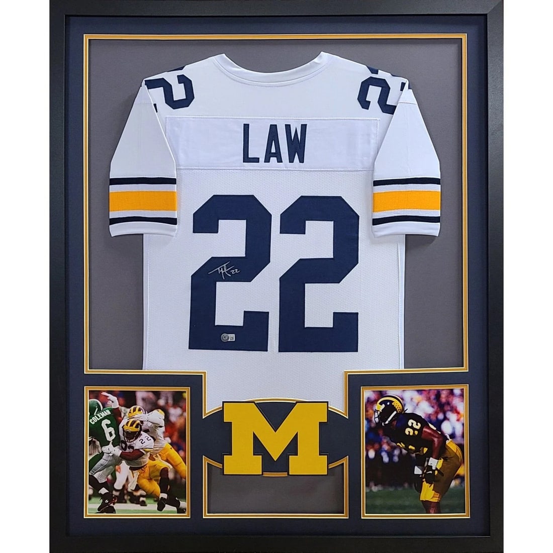 Framed Michigan White Jersey Signed by Ty Law Beckett Authenticated: Framed Michigan White Jersey Signed by Ty Law Beckett Authenticated This autographed Frank Thomas jersey, framed beautifully, is a must-have for any Chicago White Sox fan. Authenticated by JSA, a lead