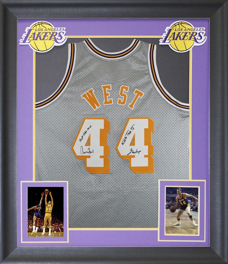 Framed Jerry West Signed Lakers Grey Swingman Jersey With Inscriptions BAS Authenticated: Framed Jerry West Signed Lakers Grey Swingman Jersey With Inscriptions BAS Authenticated This framed grey 75th Anniversary Mitchell & Ness Hardwood Classics Swingman jersey features the authentic hand