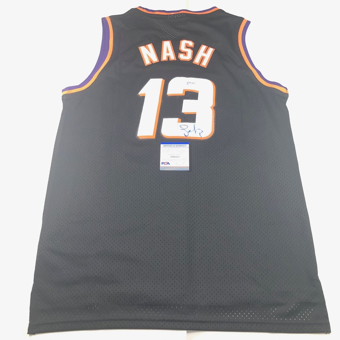 Phoenix Suns Steve Nash Autographed Jersey Authenticated by PSA/DNA: Phoenix Suns Steve Nash Autographed Jersey Authenticated by PSA/DNA This is a pre-owned Phoenix Suns jersey autographed by Steve Nash, a prominent player in NBA history. The autograph has been authent