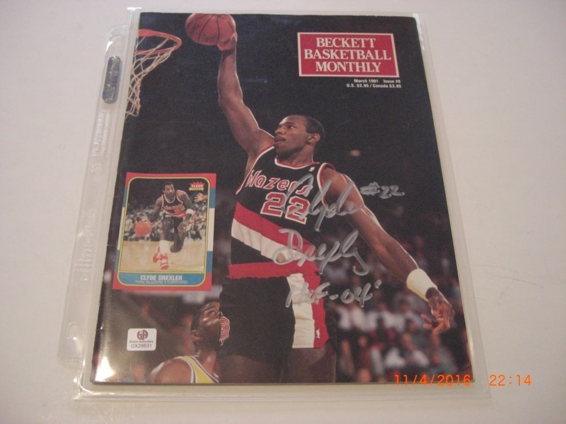 Beckett Hologram Magazine Signed by Clyde Drexler Houston Rockets HOF: Beckett Hologram Magazine Signed by Clyde Drexler Houston Rockets HOF This is a pre-owned Beckett magazine featuring Clyde Drexler of the Houston Rockets. The magazine is signed and includes a GAI hol