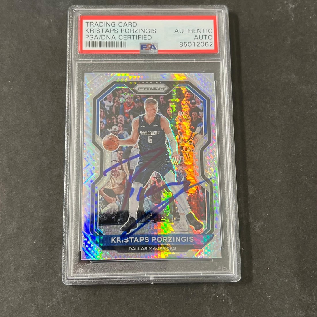 2020-21 Panini Prizm Kristaps Porzingis Signed Card PSA/DNA Mavericks: 2020-21 Panini Prizm Kristaps Porzingis Signed Card PSA/DNA Mavericks This is a 2020-21 Panini Prizm #18 card featuring the signature of Kristaps Porzingis from the Dallas Mavericks. The card has been