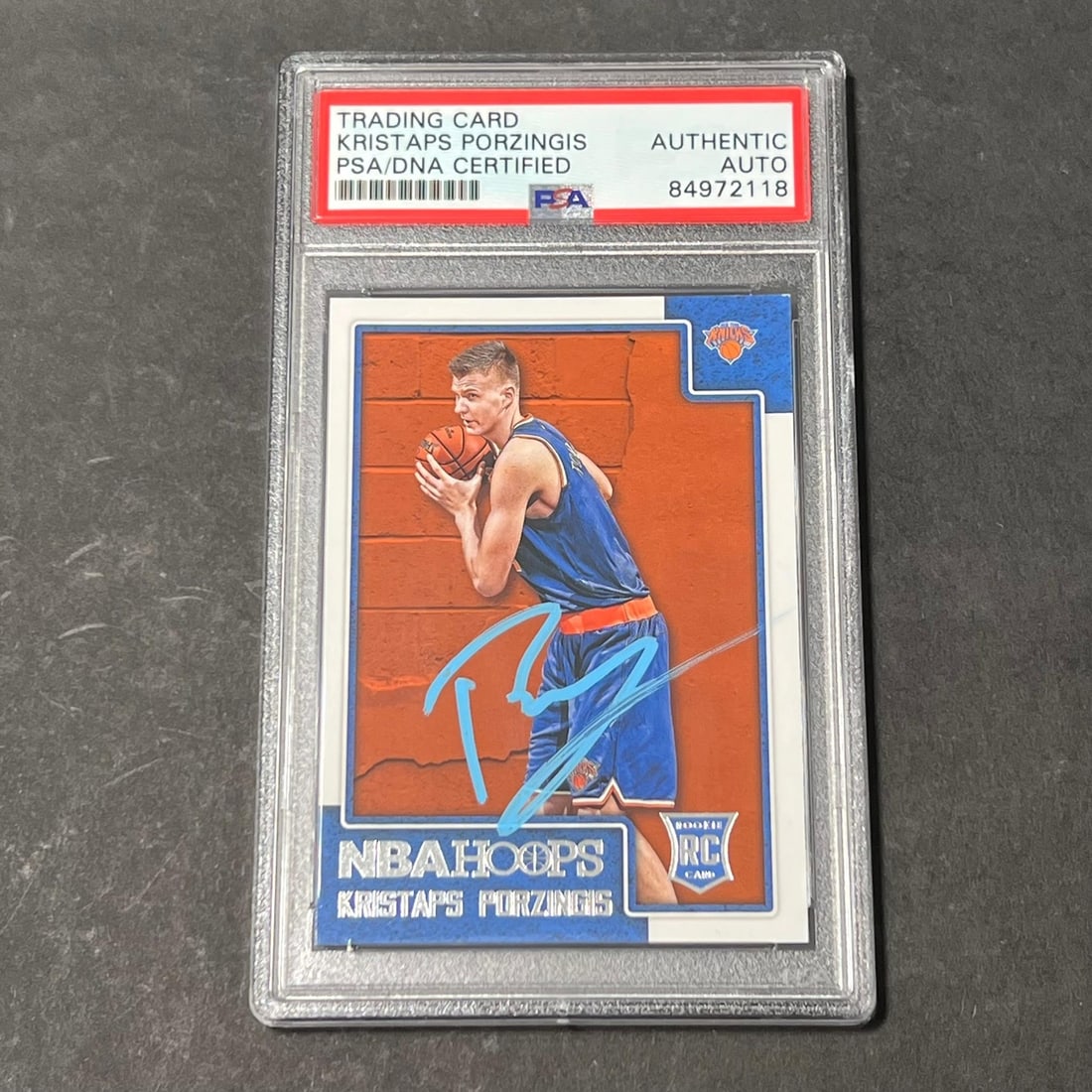 2015-16 Panini Hoops Kristaps Porzingis PSA DNA Autographed Knicks RC Card: 2015-16 Panini Hoops Kristaps Porzingis PSA DNA Autographed Knicks RC Card This is a 2015-16 Panini Hoops #261 rookie card featuring Kristaps Porzingis of the New York Knicks. The card is hand-signed 