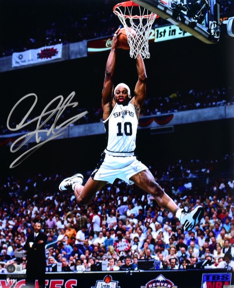 San Antonio Spurs 16x20 Photo Signed by Dennis Rodman Beckett Authenticated: San Antonio Spurs 16x20 Photo Signed by Dennis Rodman Beckett Authenticated This 16x20 photo features Dennis Rodman in action during his time with the San Antonio Spurs. The photo is hand-signed by De