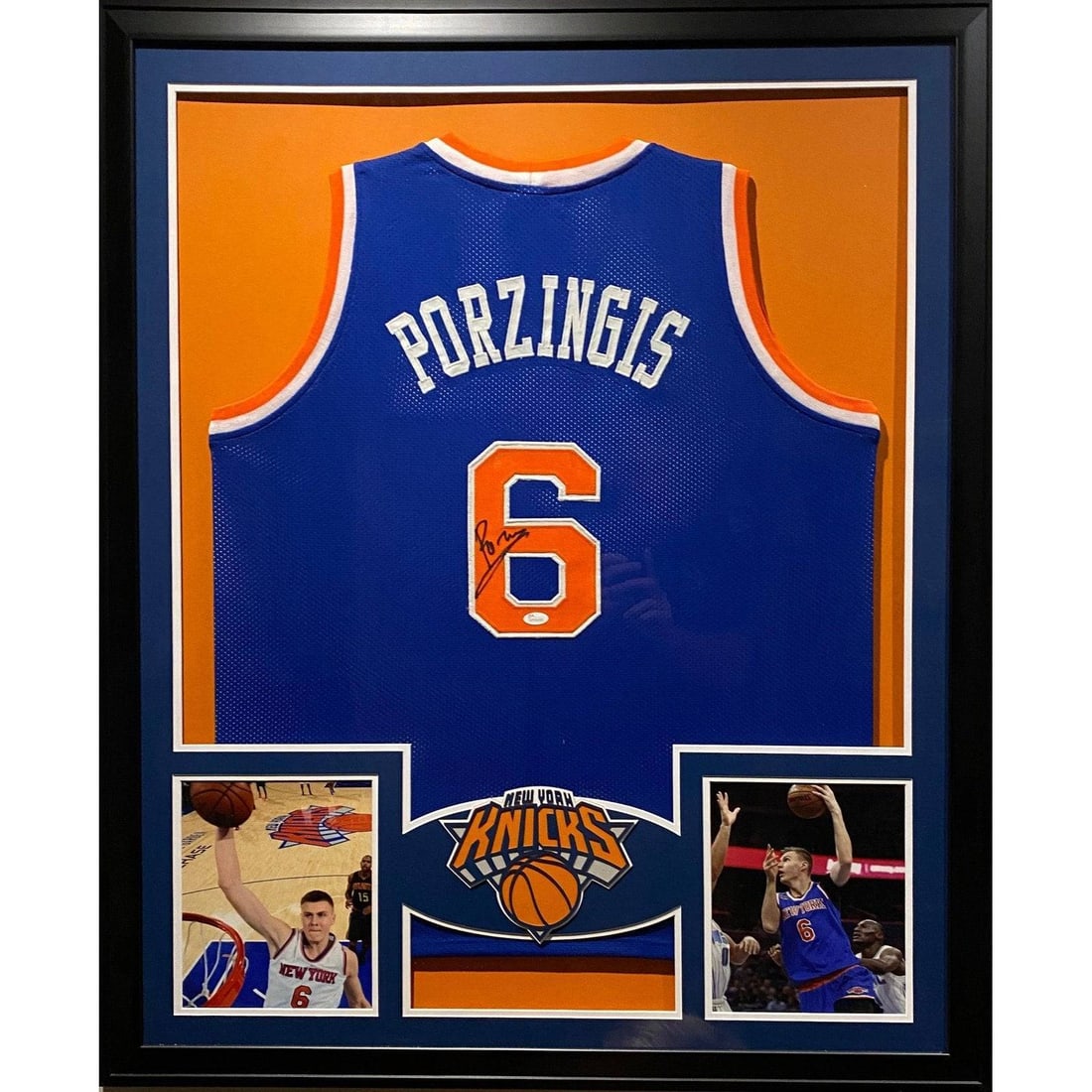 Framed Knicks Jersey Signed by Kristaps Porzingis with JSA Authentication: Framed Knicks Jersey Signed by Kristaps Porzingis with JSA Authentication This framed jersey features an authentic Kristaps Porzingis autograph and represents his time with the New York Knicks. The si