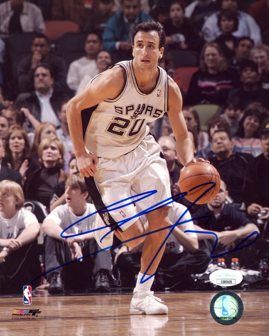 Manu Ginobili signed 8x10 PhotoFile Spurs photo JSA COA: Manu Ginobili signed 8x10 PhotoFile Spurs photo JSA COA This is an original 8x10 vertical PhotoFile photograph personally signed by Manu Ginobili of the San Antonio Spurs. The autograph is authenticat