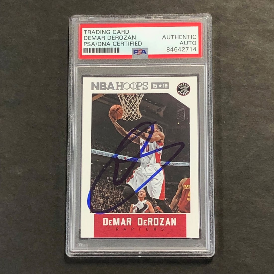2015-16 NBA Hoops DeMar DeRozan Signed Card PSA Authentic Raptors: 2015-16 NBA Hoops DeMar DeRozan Signed Card PSA Authentic Raptors Showcasing the 2015-16 NBA Hoops #59 card, this collectible features the autograph of DeMar DeRozan, a standout player for the Toronto