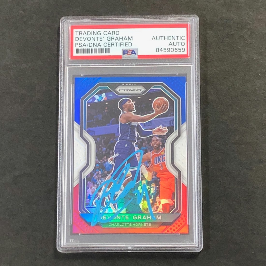 2020-21 Panini Prizm Red White Blue #73 Devonte Graham Autographed Card PSA/DNA: 2020-21 Panini Prizm Red White Blue #73 Devonte Graham Autographed Card PSA/DNA This 2020-21 Panini Prizm Red White and Blue #73 card features the autograph of Devonte' Graham, a standout player. The 