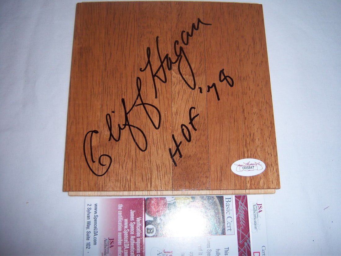 Cliff Hagan signed 6x6 Hawks floorboard JSA COA: Cliff Hagan signed 6x6 Hawks floorboard JSA COA This is an original 6x6 inch floorboard signed by Cliff Hagan, commemorating his induction into the Hall of Fame in 1978. The piece is associated with t