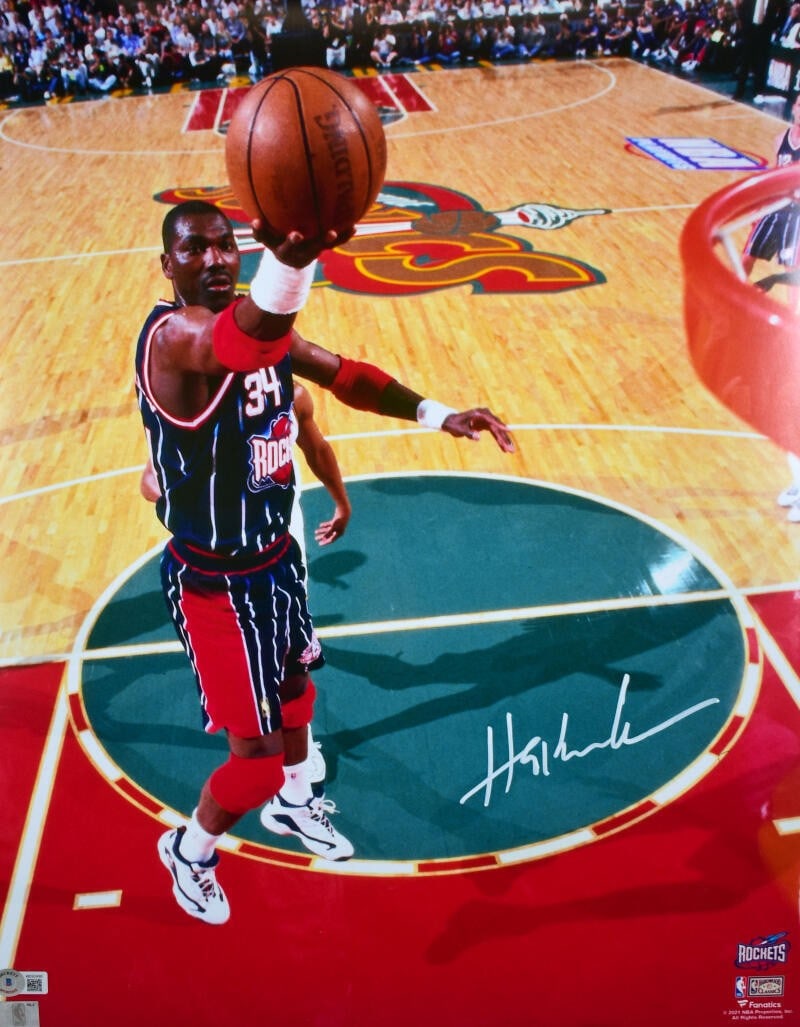 Hakeem Olajuwon signed Houston Rockets 16x20 layup photo Beckett holo: Hakeem Olajuwon signed Houston Rockets 16x20 layup photo Beckett holo This is a 16x20 photograph featuring Hakeem Olajuwon of the Houston Rockets, autographed by the player. The signature has been aut