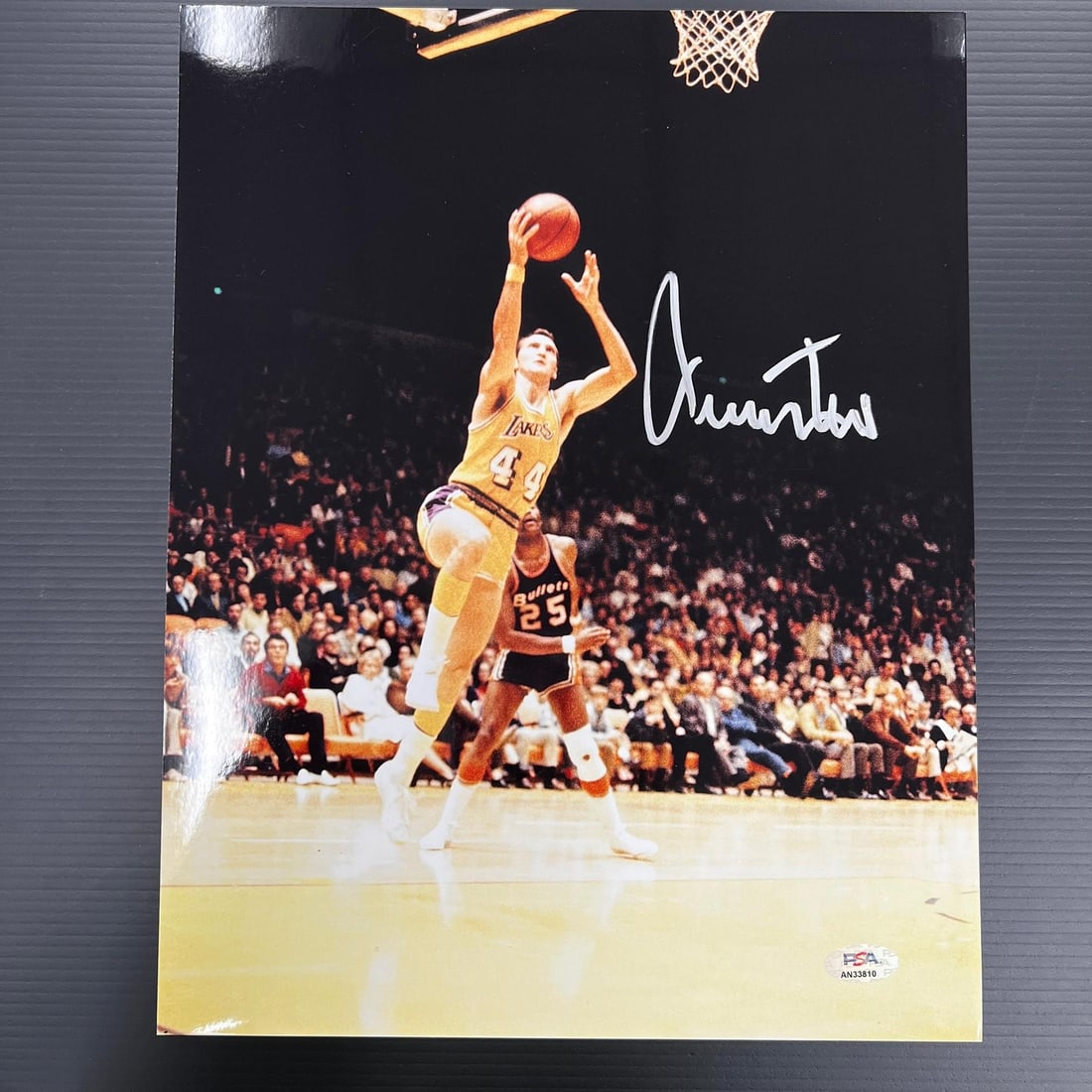 Jerry West PSA DNA signed 11x14 basketball photo: Jerry West PSA DNA signed 11x14 basketball photo This is a professionally printed 11x14 photograph featuring Jerry West, renowned for his career with the Los Angeles Lakers. The photo is hand-signed b