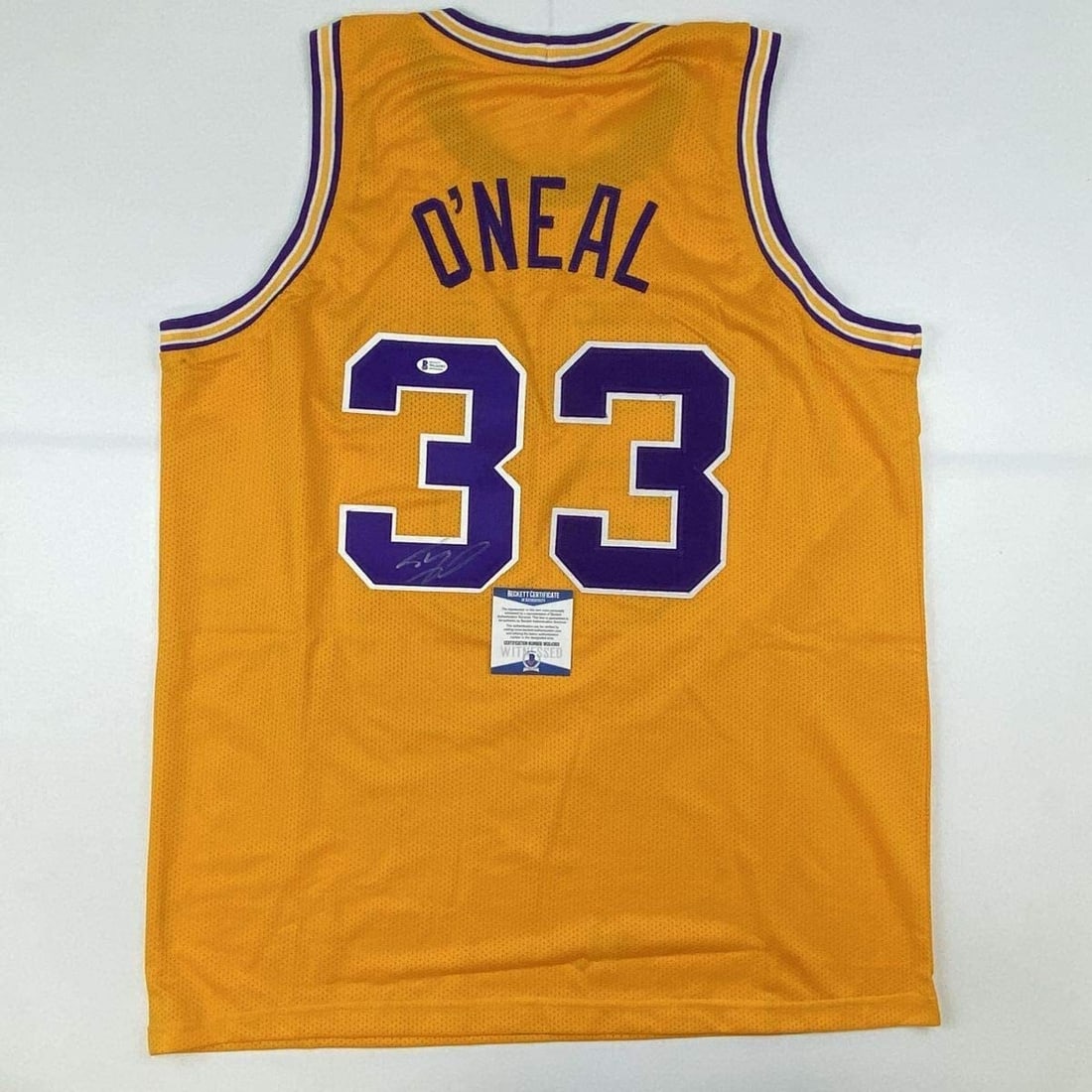Shaquille O'Neal Autographed LSU Yellow Jersey Beckett BAS COA: Shaquille O'Neal Autographed LSU Yellow Jersey Beckett BAS COA This autographed Shaquille O'Neal LSU Yellow Jersey is a must-have collectible for fans of the basketball legend. Authenticated by Becket