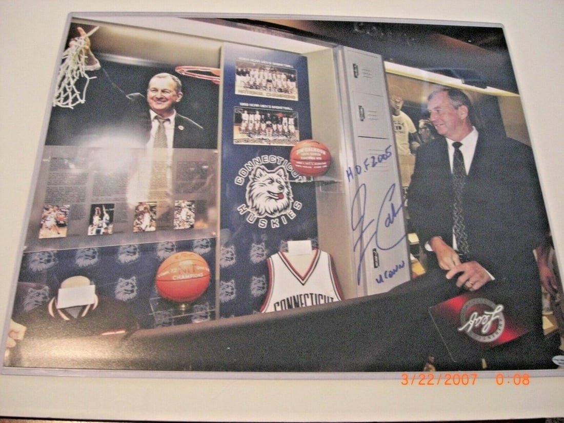 Jim Calhoun Signed 16x20 UConn Huskies Photo with COA Hall of Fame 2005: Jim Calhoun Signed 16x20 UConn Huskies Photo with COA Hall of Fame 2005 This is a pre-owned, original 16x20 photograph signed by Jim Calhoun, associated with the Connecticut Huskies. The photo comes w