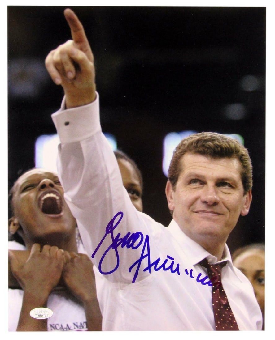 Signed 11x14 Photo of Geno Auriemma with JSA Authentication: Signed 11x14 Photo of Geno Auriemma with JSA Authentication This is a signed 11x14 photo of Geno Auriemma, the esteemed Women's Basketball Coach of the University of Connecticut. The photograph is aut