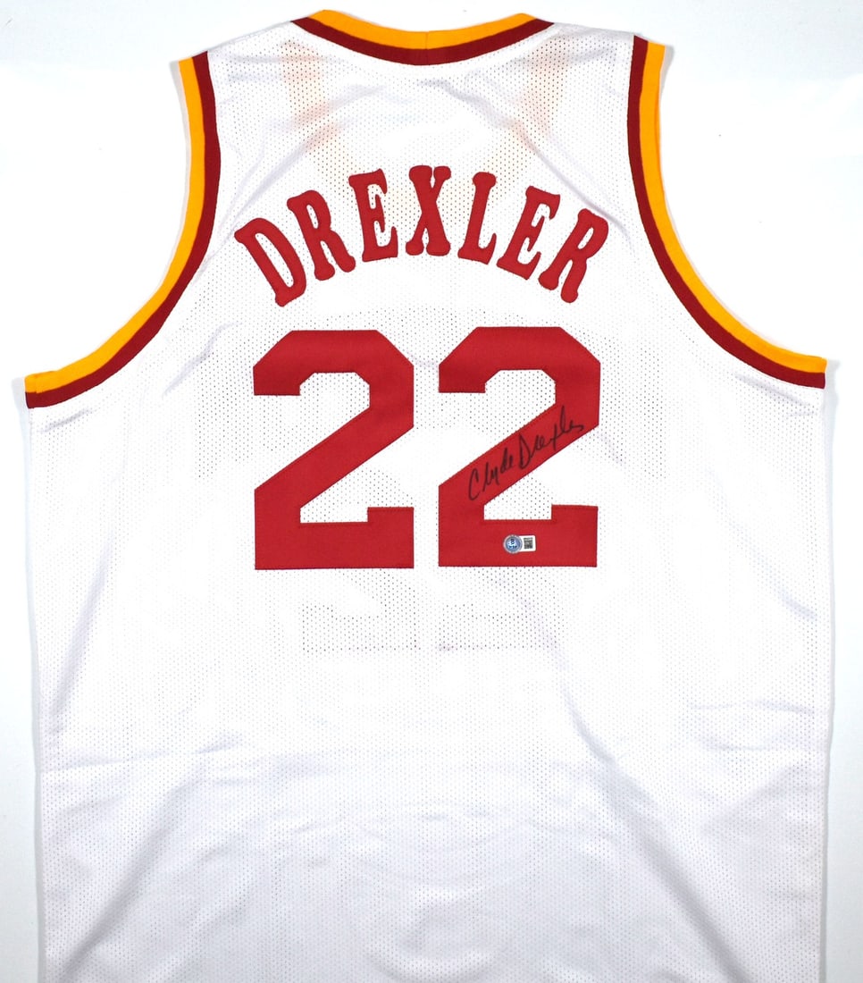Clyde Drexler Signed Houston Rockets White Pro Style Jersey Beckett Hologram: Clyde Drexler Signed Houston Rockets White Pro Style Jersey Beckett Hologram This white pro style jersey features the authentic autograph of Clyde Drexler. Representing the Houston Rockets, the jersey