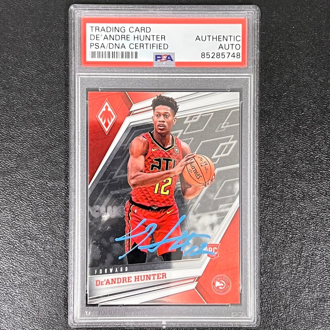 2019-20 Panini Chronicles Phoenix De'Andre Hunter Signed Card PSA/DNA: 2019-20 Panini Chronicles Phoenix De'Andre Hunter Signed Card PSA/DNA This 2019-20 Panini Chronicles Phoenix #575 card features the autograph of De'Andre Hunter, a prominent player for the Atlanta Haw