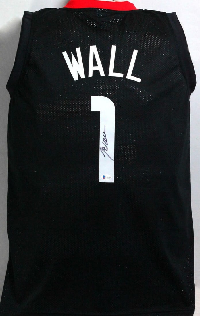 Beckett Witness John Wall Houston Rockets autographed black jersey: Beckett Witness John Wall Houston Rockets autographed black jersey This is a pre-owned black Houston Rockets jersey autographed by John Wall. The signature has been authenticated by Beckett, ensuring 