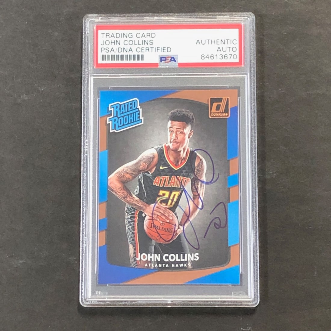2017-18 Donruss Rated Rookie #182 John Collins Signed PSA/DNA Card: 2017-18 Donruss Rated Rookie #182 John Collins Signed PSA/DNA Card This is a 2017-18 Donruss Rated Rookie #182 card featuring a bold autograph by John Collins of the Atlanta Hawks. The signed card has