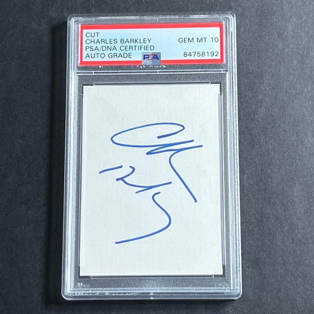 PSA DNA graded Charles Barkley signed cut Phoenix Suns: PSA DNA graded Charles Barkley signed cut Phoenix Suns This is an original cut autograph signed by NBA legend Charles Barkley, encapsulated by PSA/DNA. The signature is on notebook paper and has been 