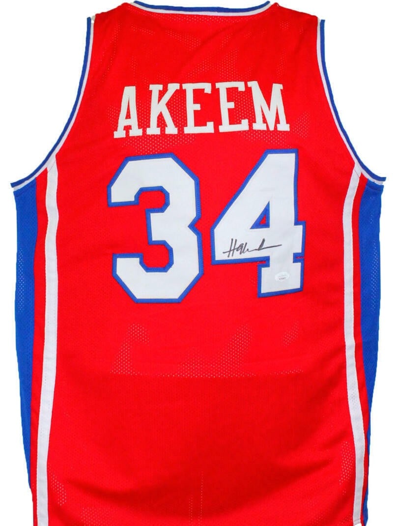 Hakeem Olajuwon signed red college style basketball jersey JSA witnessed: Hakeem Olajuwon signed red college style basketball jersey JSA witnessed This red college style basketball jersey is autographed by Hakeem Olajuwon and comes with authentication from James Spence Auth