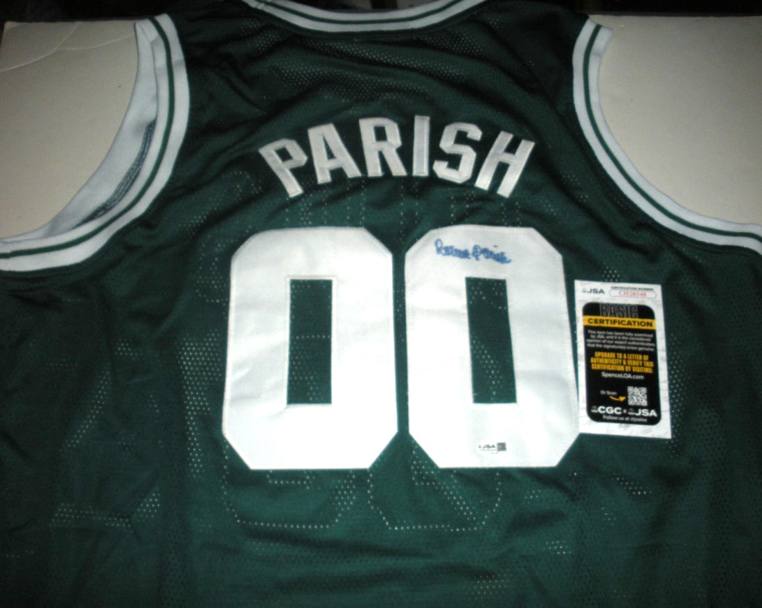 Robert Parich Boston Signed Mitchell & Ness Jersey JSA COA: Robert Parich Boston Signed Mitchell & Ness Jersey JSA COA This is an officially licensed Mitchell & Ness jersey, signed by Robert Parish, a legendary figure in basketball. The jersey is an original p