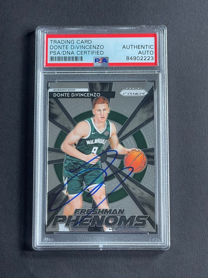 2018-19 Panini Prizm Donte DiVincenzo Signed Card PSA/DNA Authentic: 2018-19 Panini Prizm Donte DiVincenzo Signed Card PSA/DNA Authentic This is a 2018-19 Panini Prizm Freshman Phenoms #9 trading card featuring the autograph of Donte DiVincenzo, a notable player for th