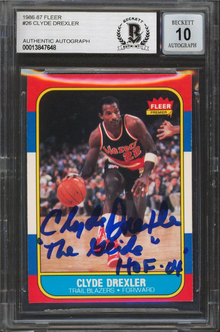 Clyde Drexler signed 1986 Fleer rookie card with inscription BAS slab: Clyde Drexler signed 1986 Fleer rookie card with inscription BAS slab This 1986 Fleer #26 rookie card features Clyde Drexler of the Portland Trail Blazers. The card is personally signed by Drexler and