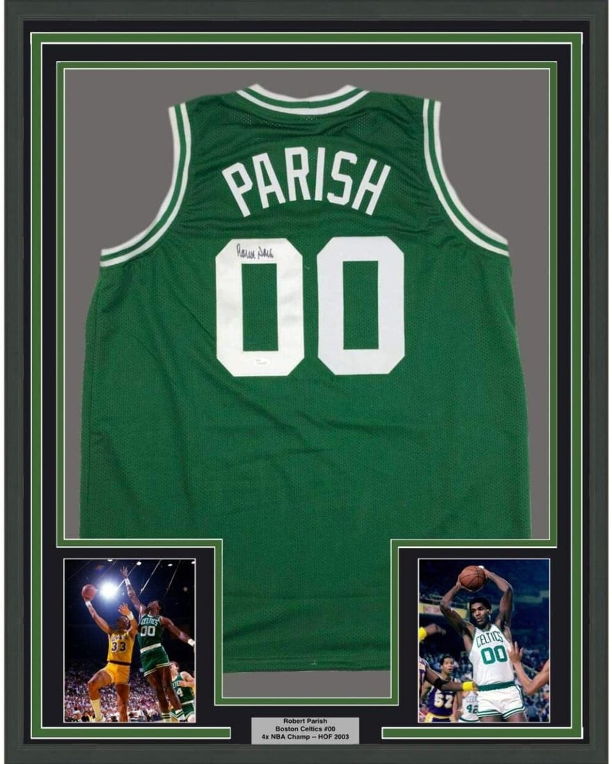Robert Parish Signed Framed Boston Celtics Jersey JSA COA 33x42: Robert Parish Signed Framed Boston Celtics Jersey JSA COA 33x42 This professionally framed and matted Boston Celtics green jersey features the authentic signature of NBA legend Robert Parish. The disp