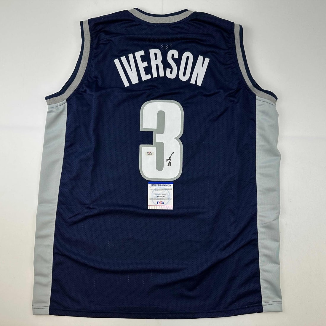Autographed Allen Iverson Georgetown Blue College Jersey PSA/DNA: Autographed Allen Iverson Georgetown Blue College Jersey PSA/DNA This authentic Allen Iverson Georgetown Blue College Basketball Jersey is a must-have for collectors and fans alike. It features Iverso