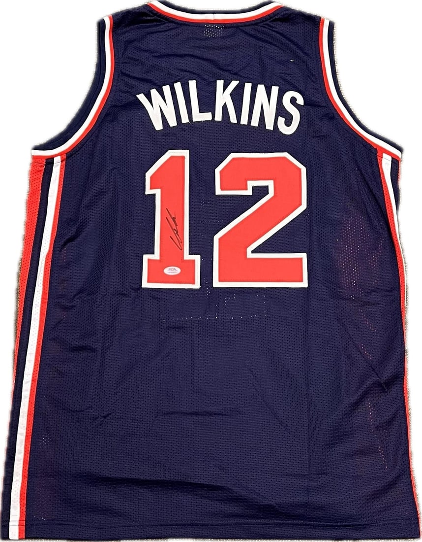 Dominique Wilkins Autographed Team USA Jersey PSA/DNA Authentic: Dominique Wilkins Autographed Team USA Jersey PSA/DNA Authentic This is an original stitched jersey signed by basketball legend Dominique Wilkins, renowned for his contributions to Team USA. The autog