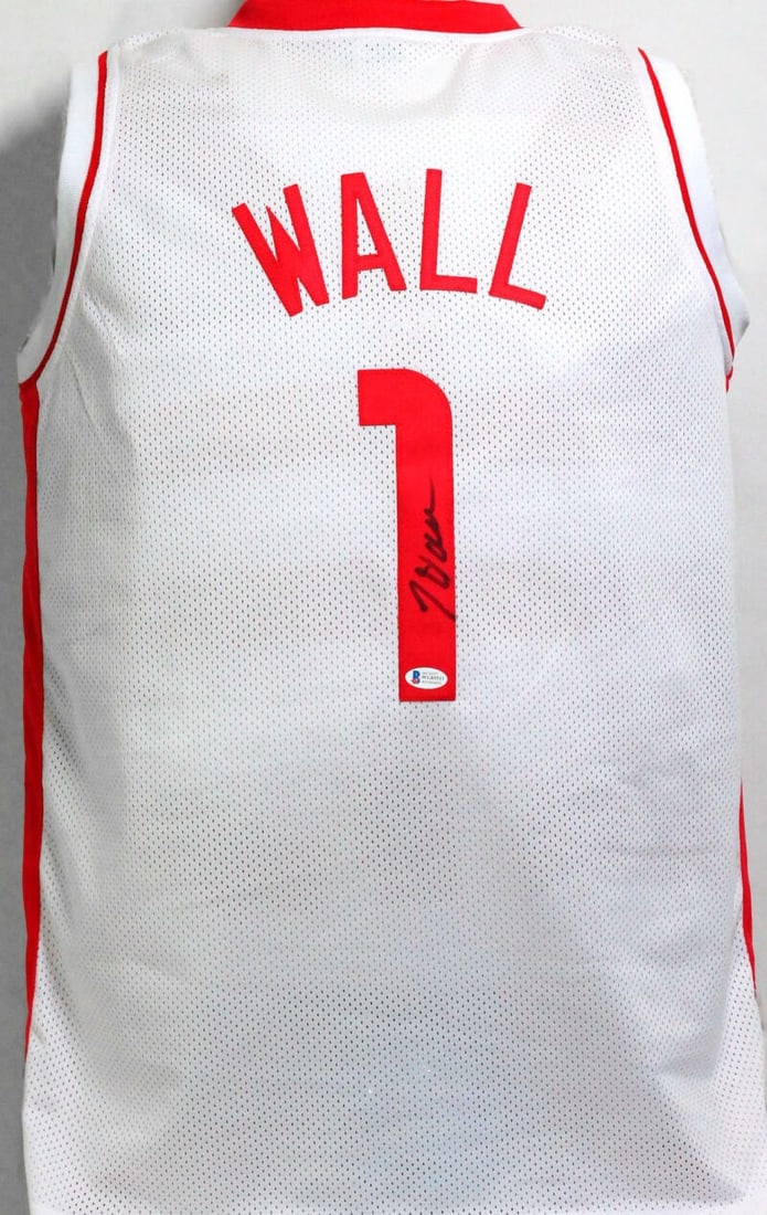 John Wall signed Houston Rockets white jersey Beckett Witness: John Wall signed Houston Rockets white jersey Beckett Witness This is a white Houston Rockets jersey autographed by John Wall. The autograph has been authenticated by Beckett. The jersey is in pre-own