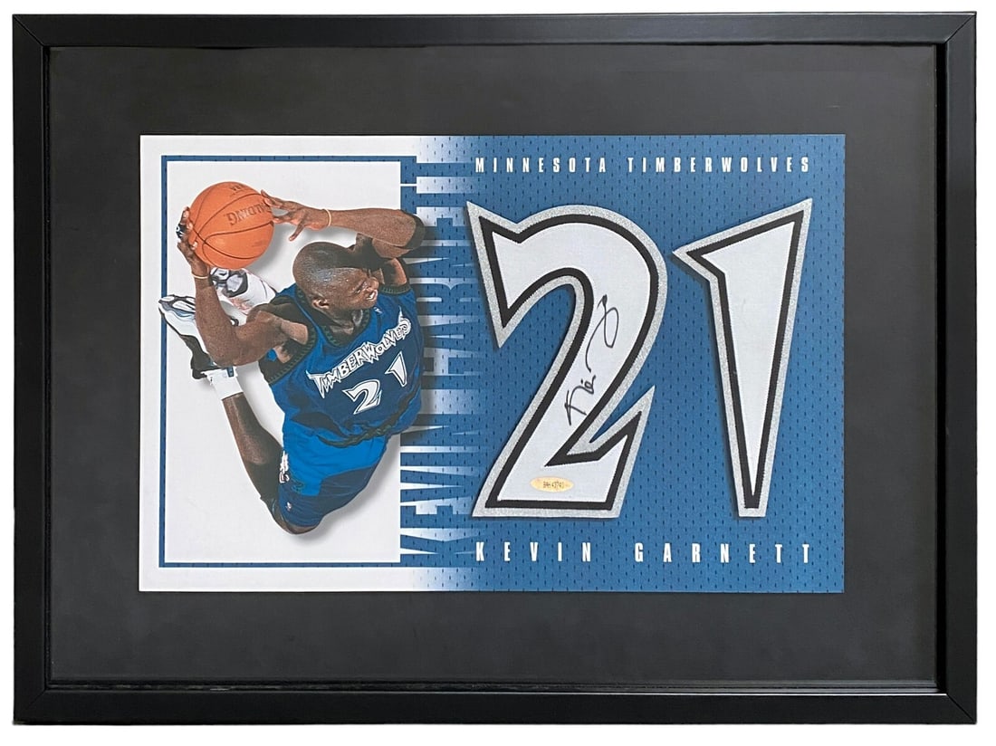 Kevin Garnett Signed Jersey Display with Upper Deck COA 16.5x22.5: Kevin Garnett Signed Jersey Display with Upper Deck COA 16.5x22.5 This is a framed display featuring a signed jersey by Hall of Famer Kevin Garnett, known for his exceptional career in basketball. The